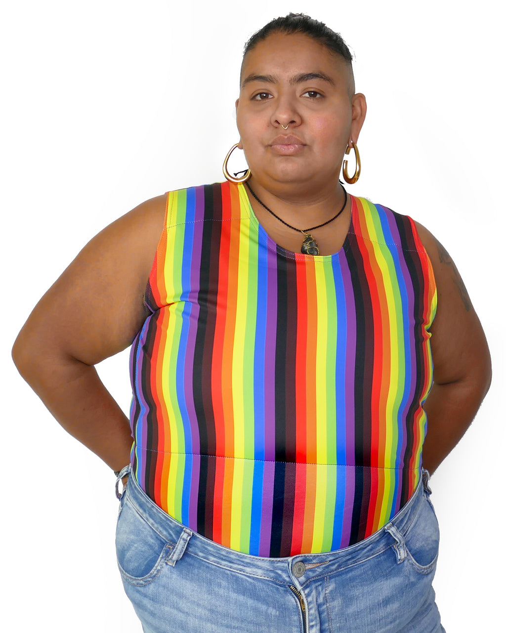 Person wearing More Color More Pride Binder, with Rainbow, Black and Brown vertical stripes.