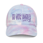 tie-dye embroidered hat features purple "in our bones" logo design