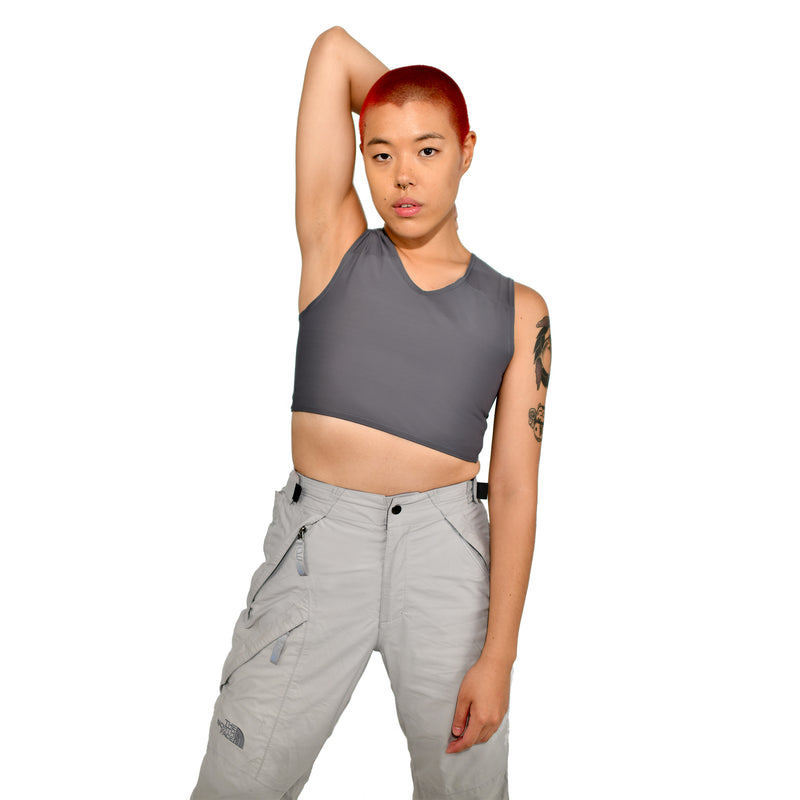 Model shows off a gray half binder, facing forward and holding one arm casually behind the head.