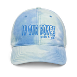 tie-dye embroidered hat features "in our bones" logo design